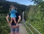 Toddler on Piggyback rider at Akaka Falls State Park, Big Island Hawaii.