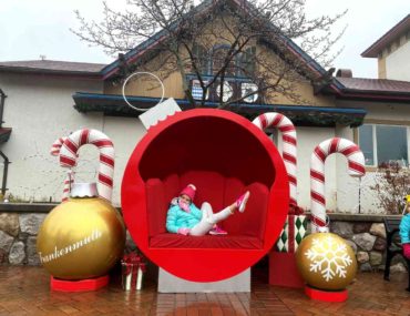 A girl Relaxes in an ornament decoration at Christmas in Frankenmuth